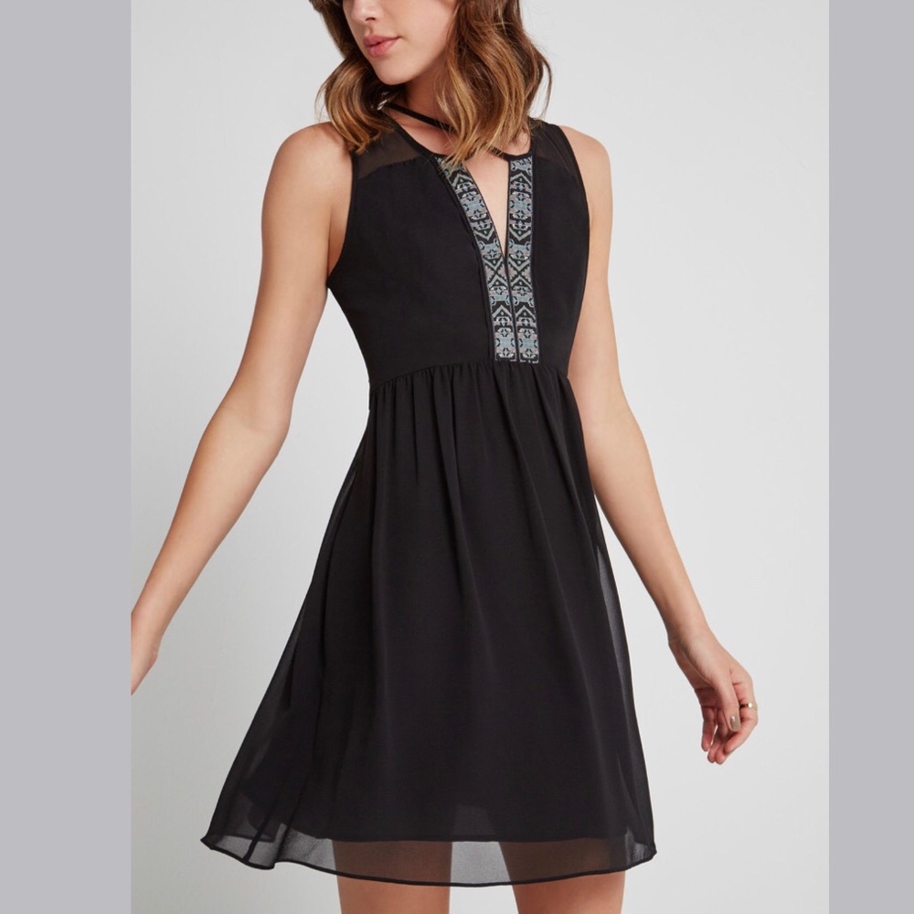 Black minidress with cross back detail
